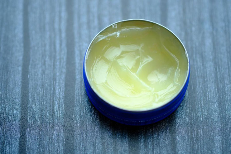 Massage petroleum jelly on your nails