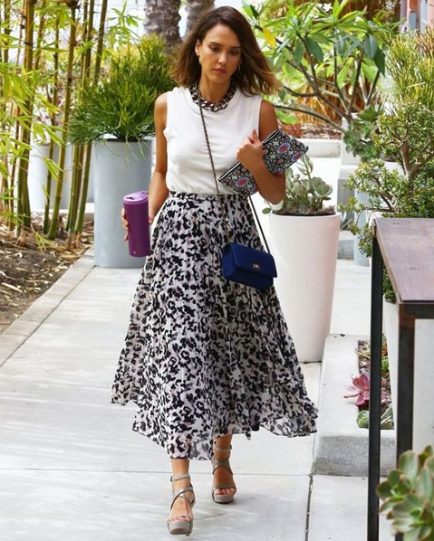 The Feminine Look Sleeveless White Top And Flary Printed Skirt